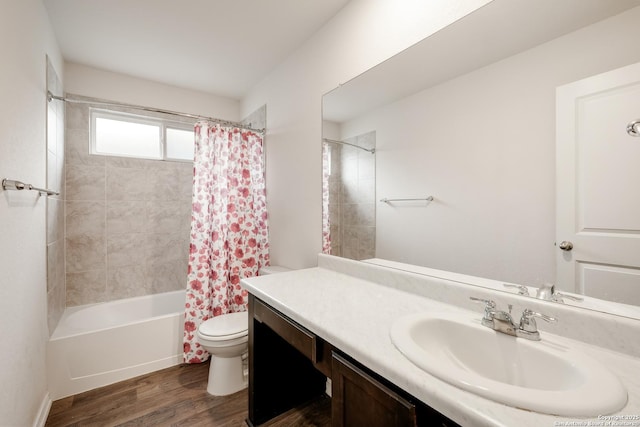 bathroom with toilet, shower / bath combination with curtain, wood finished floors, and vanity