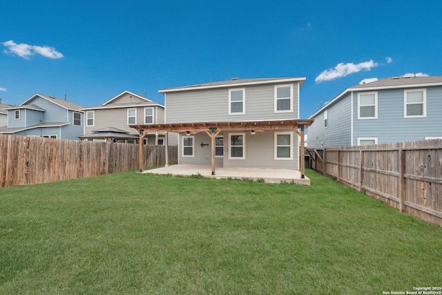 back of property featuring a yard, a fenced backyard, a residential view, and a patio