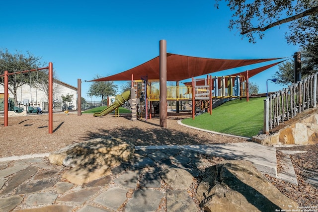 community play area featuring fence