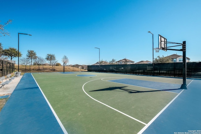 view of sport court featuring community basketball court and fence