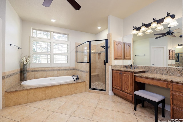 bathroom with tile patterned floors, a garden tub, a stall shower, a ceiling fan, and vanity