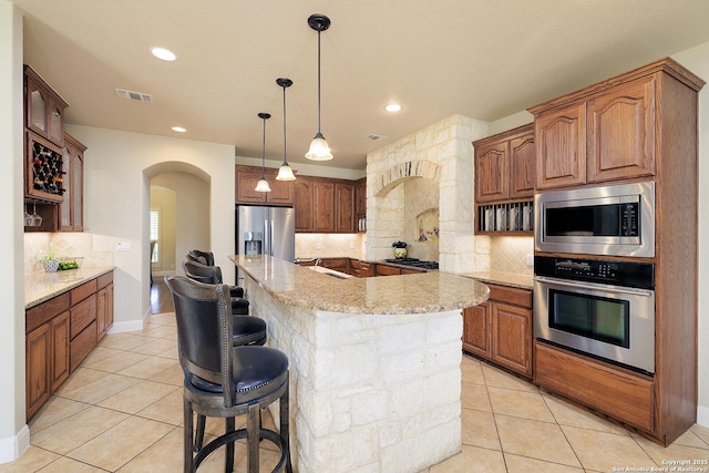 kitchen featuring a sink, visible vents, appliances with stainless steel finishes, and light tile patterned floors