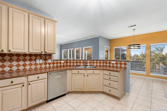 kitchen featuring dishwasher, backsplash, a peninsula, pendant lighting, and a sink