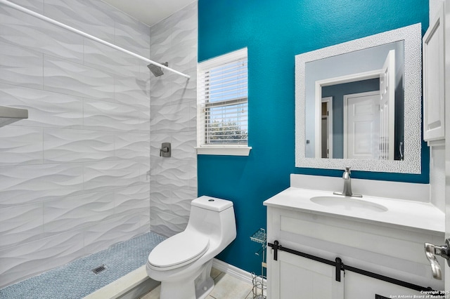 full bath featuring a stall shower, vanity, and toilet