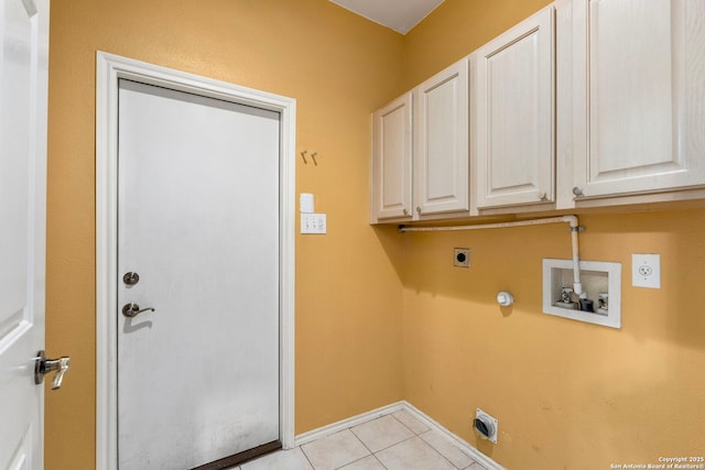 clothes washing area featuring cabinet space, light tile patterned floors, gas dryer hookup, hookup for a washing machine, and hookup for an electric dryer