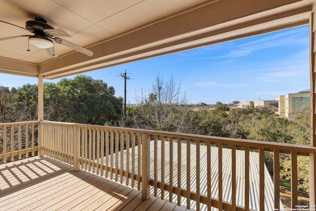 wooden terrace featuring ceiling fan