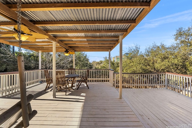 wooden deck featuring a ceiling fan