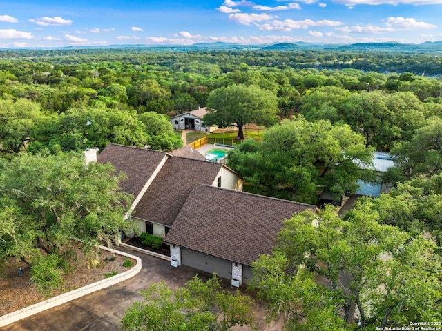 bird's eye view featuring a view of trees