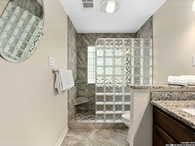 bathroom featuring marble finish floor, visible vents, toilet, vanity, and a walk in shower