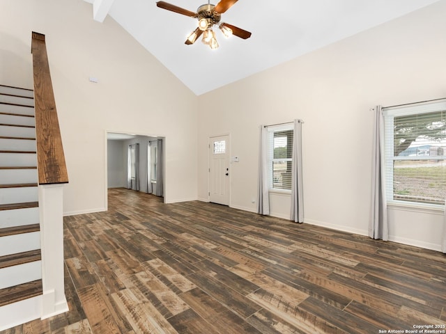 unfurnished living room featuring dark wood-style floors, a ceiling fan, high vaulted ceiling, baseboards, and stairs