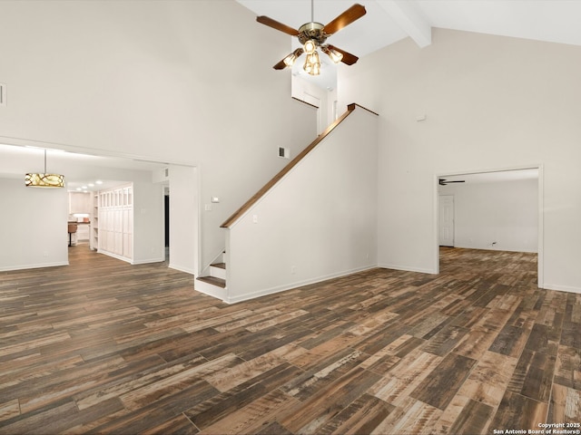 unfurnished living room with high vaulted ceiling, dark wood-style flooring, a ceiling fan, stairway, and beam ceiling