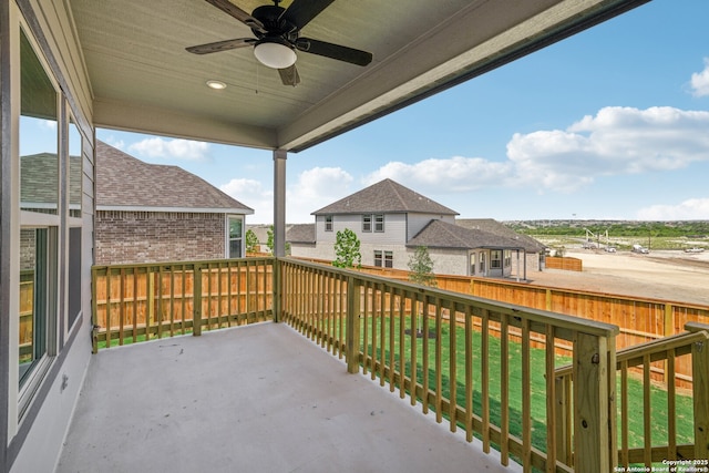 view of patio featuring ceiling fan and a residential view