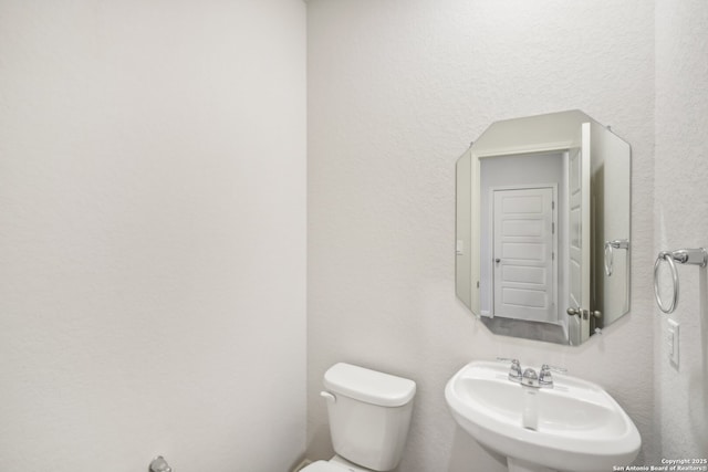 bathroom with a sink and toilet