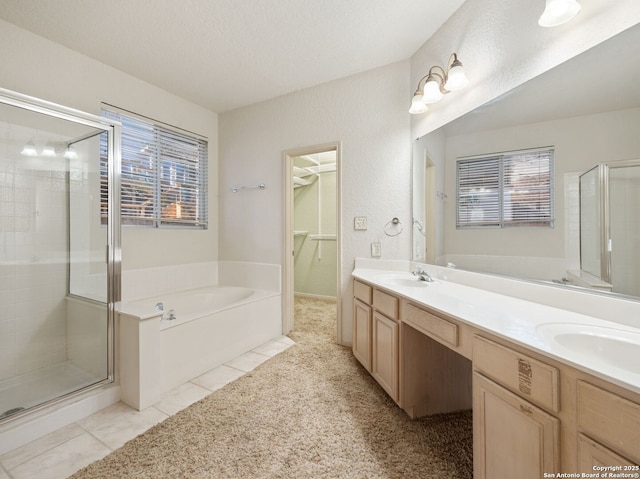 bathroom with plenty of natural light, tile patterned flooring, and a bath