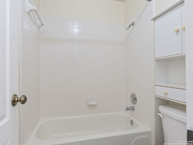 bathroom featuring  shower combination and toilet