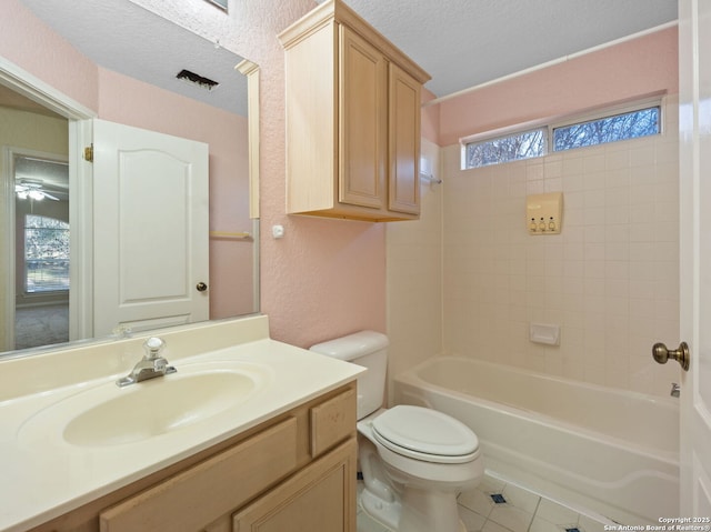 full bathroom with toilet, a textured ceiling, shower / tub combination, vanity, and tile patterned flooring