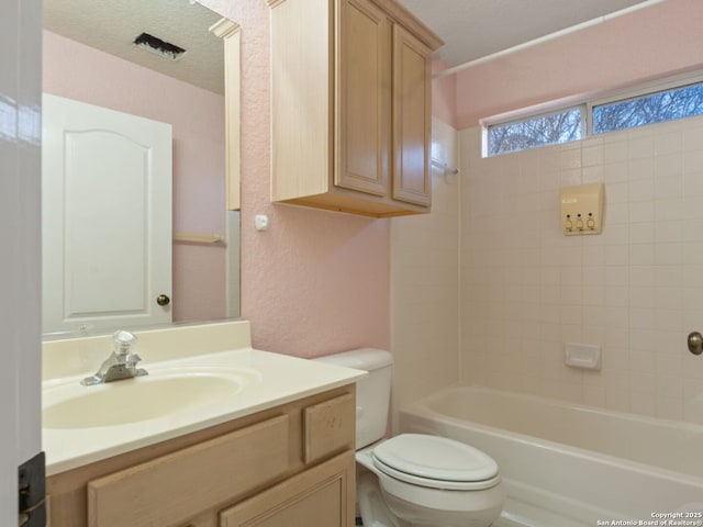 full bathroom with a textured wall, toilet, vanity, a textured ceiling, and shower / bathtub combination