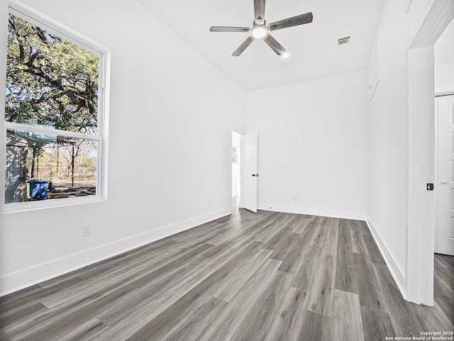 unfurnished room with ceiling fan, light wood-type flooring, visible vents, and baseboards