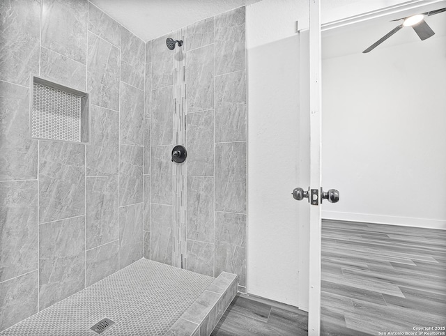 full bathroom featuring a tile shower