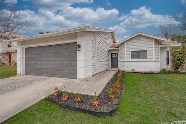 ranch-style home featuring a garage, concrete driveway, brick siding, and a front lawn