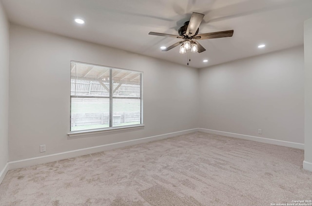 unfurnished room featuring a ceiling fan, recessed lighting, light carpet, and baseboards