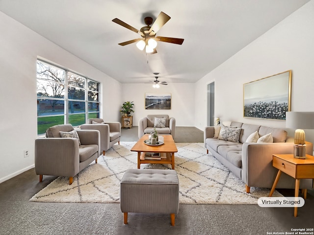 living room with ceiling fan, carpet, and baseboards