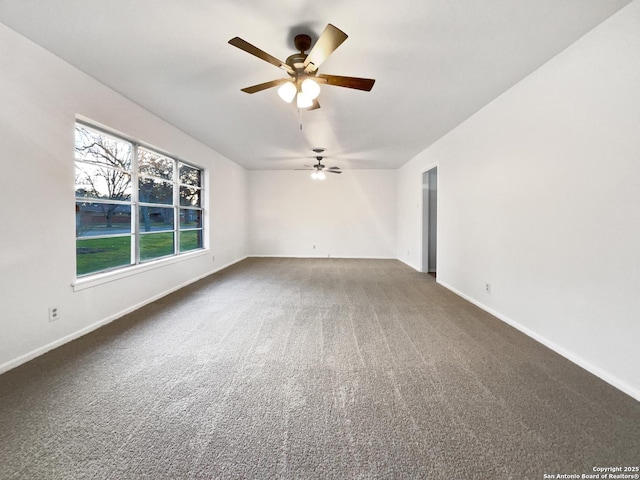 unfurnished room with ceiling fan, carpet flooring, and baseboards