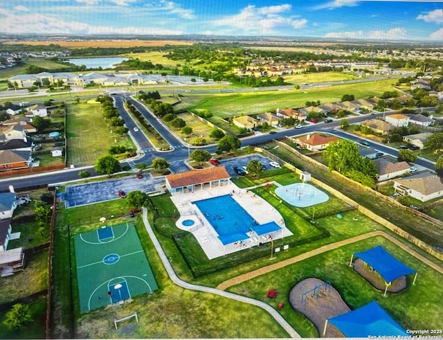 bird's eye view with a residential view and a water view