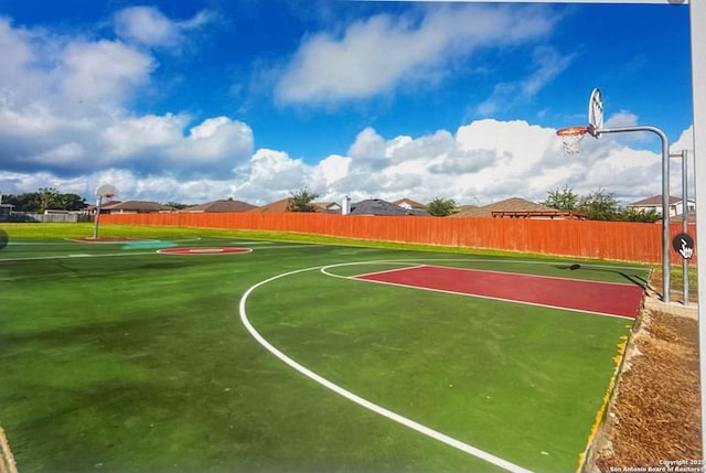 view of sport court with community basketball court and fence