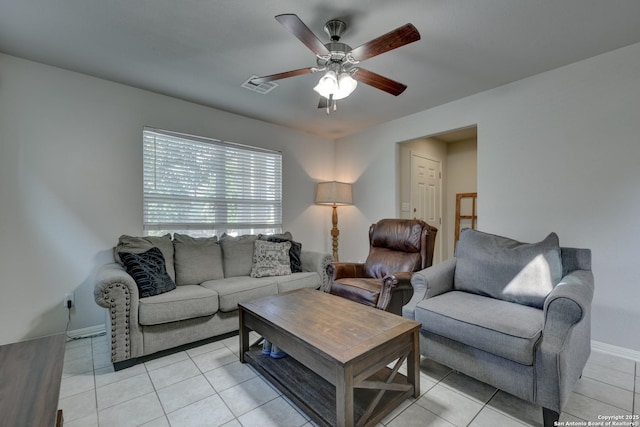 living room featuring baseboards, visible vents, a ceiling fan, and light tile patterned flooring