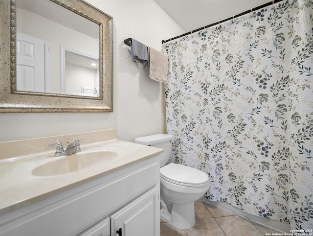 full bathroom with toilet, curtained shower, tile patterned flooring, and vanity