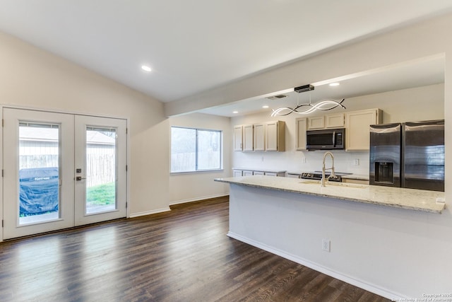 kitchen with french doors, lofted ceiling, visible vents, dark wood-type flooring, and stainless steel fridge