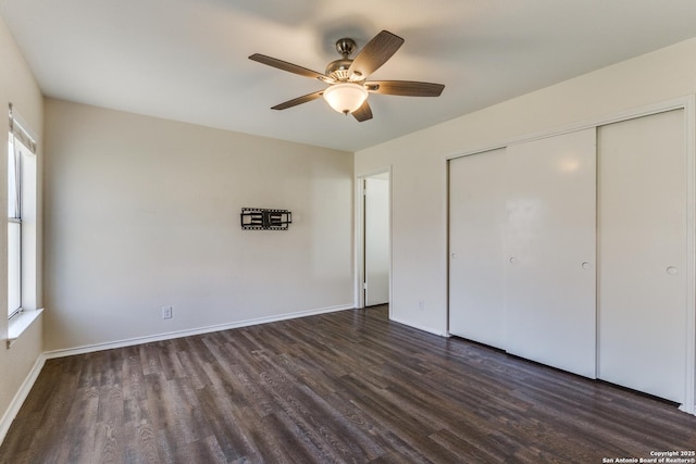 unfurnished bedroom with a ceiling fan, a closet, baseboards, and wood finished floors