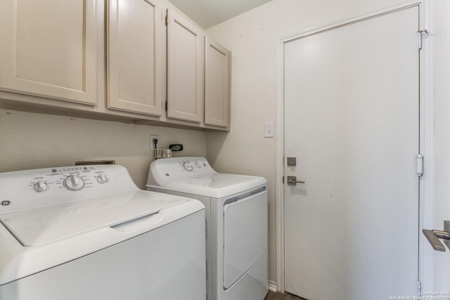 laundry area with cabinet space and washing machine and clothes dryer