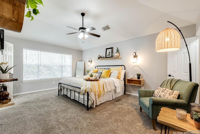 bedroom with lofted ceiling, visible vents, baseboards, and carpet flooring