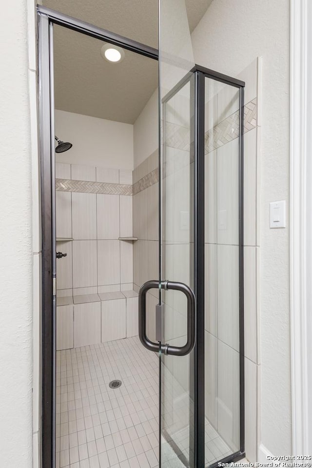 full bathroom with a tile shower