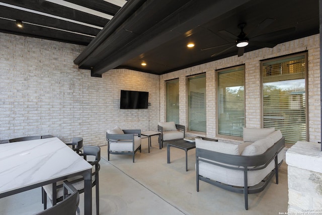 view of patio / terrace with outdoor dining area, an outdoor living space, and a ceiling fan