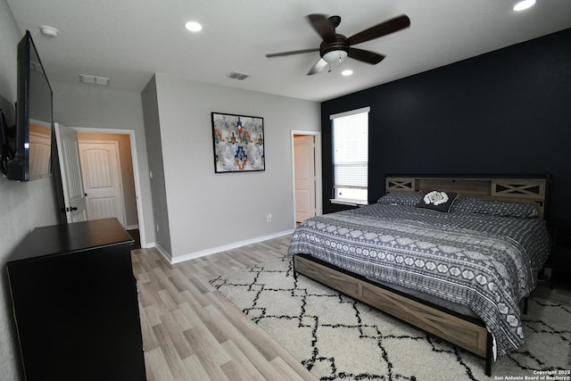 bedroom with light wood-type flooring, baseboards, visible vents, and recessed lighting