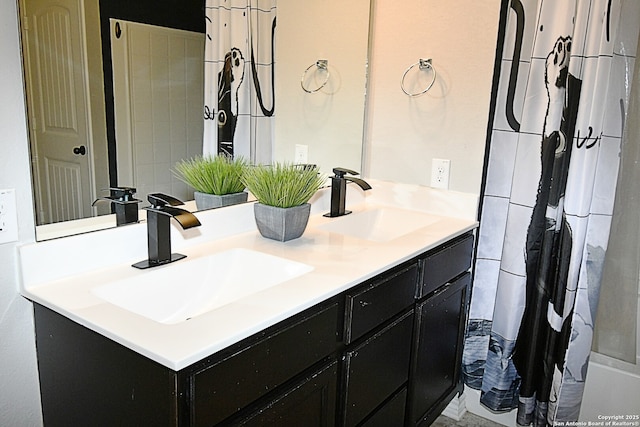 full bath with double vanity and a sink