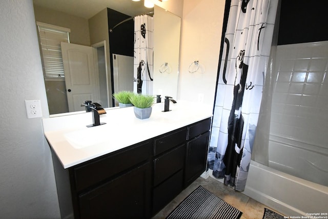 bathroom with double vanity, shower / bath combo, visible vents, and a sink