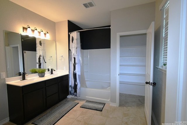 full bathroom featuring a sink, visible vents, tile patterned floors, double vanity, and shower / bathtub combination with curtain