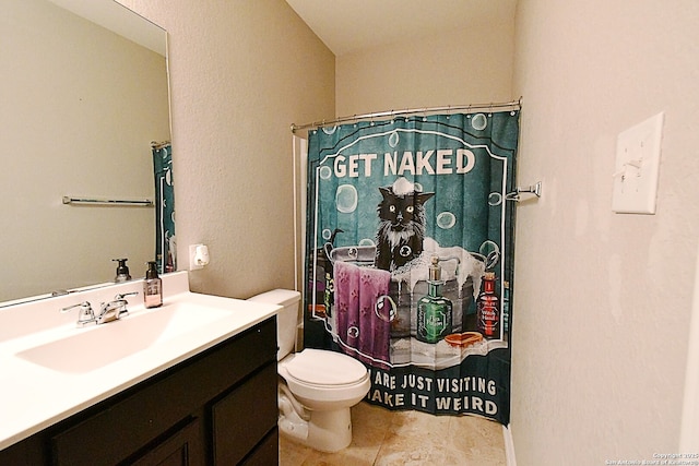 full bathroom with curtained shower, vanity, toilet, and tile patterned floors