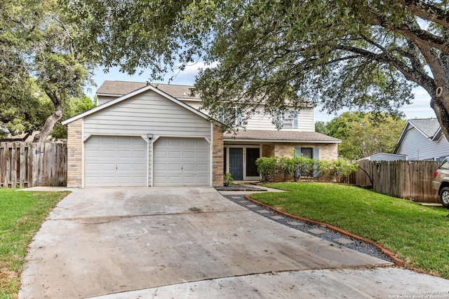 traditional-style house featuring a garage, brick siding, fence, concrete driveway, and a front yard