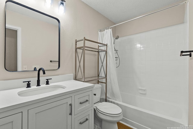 full bathroom featuring a textured ceiling, toilet, shower / bath combination with curtain, and vanity