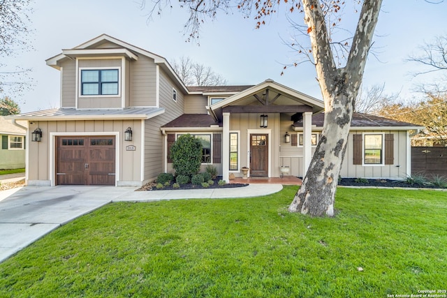 view of front of house featuring driveway, an attached garage, board and batten siding, and a front yard