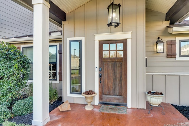 doorway to property featuring board and batten siding