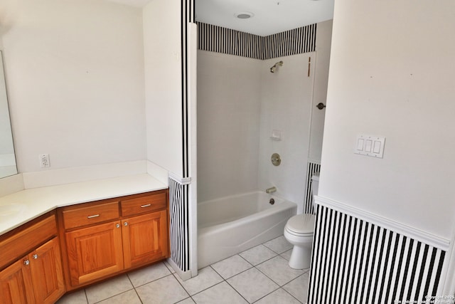 bathroom featuring tub / shower combination, vanity, toilet, and tile patterned floors