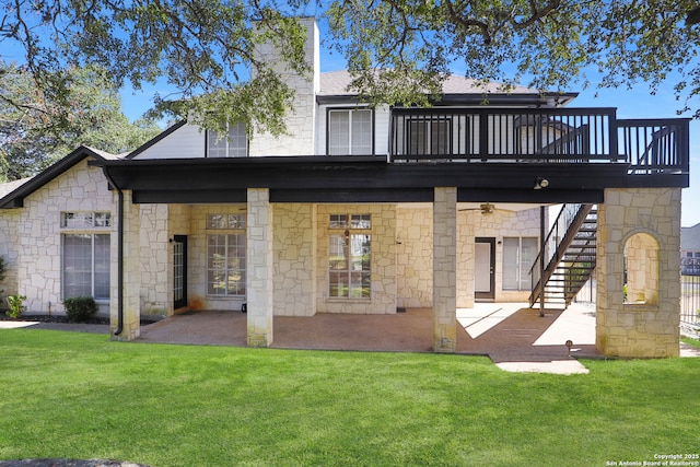 rear view of house featuring stairs, a yard, a patio area, and a wooden deck