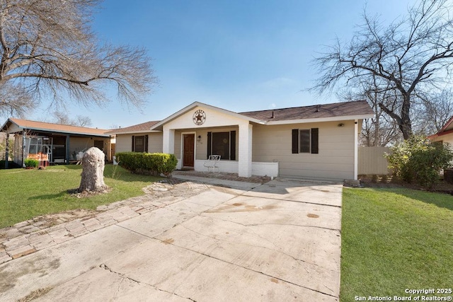 ranch-style house featuring fence and a front yard