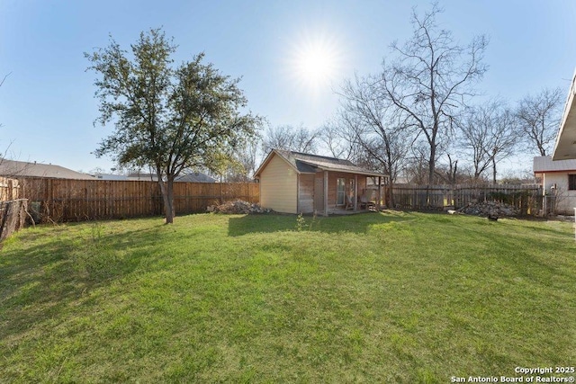 view of yard with a fenced backyard